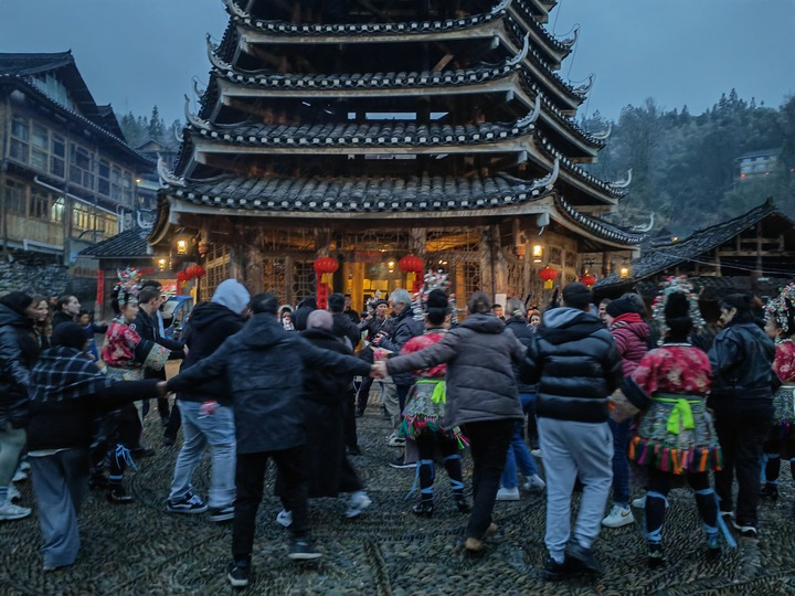 
Members of the French youth delegation dance with locals during their visit to the Dali Dong Village. (Xinhua/Luo Yu)